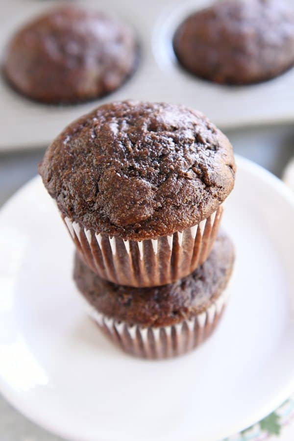 two double chocolate zucchini muffins stacked on each other