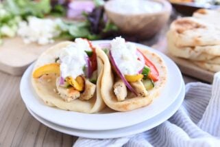 two sheet pan chicken tzatziki wraps on white plate