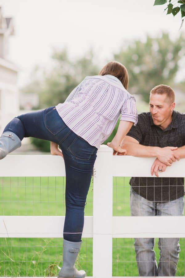 climbing over vinyl fence 