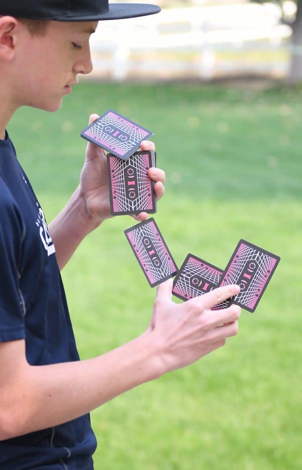 teenager showing cardistry trick