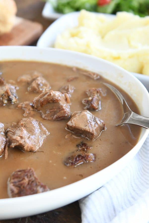 Serving bowl with beef tips and gravy.