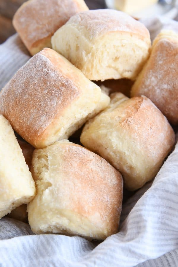 easy fluffy blender rolls piled in basket with napkin