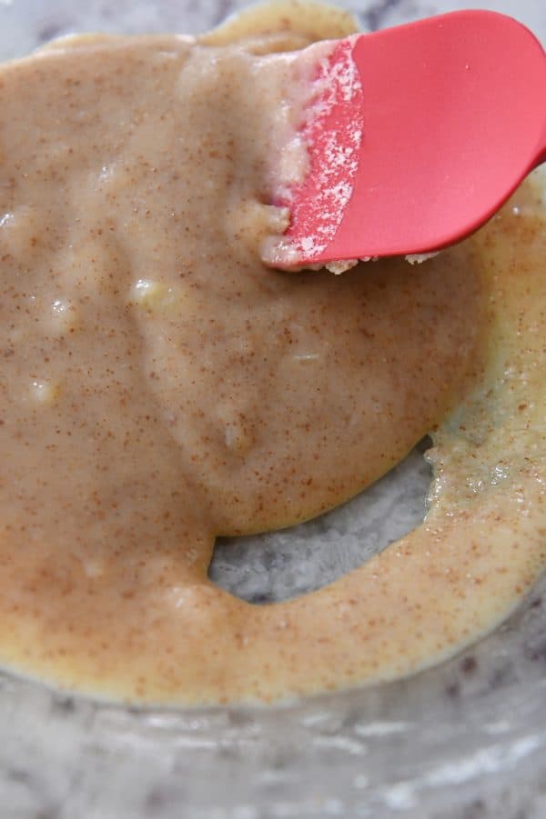 Cooled brown butter in glass bowl.