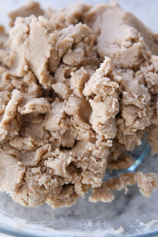 Brown butter snickerdoodle dough in glass bowl.