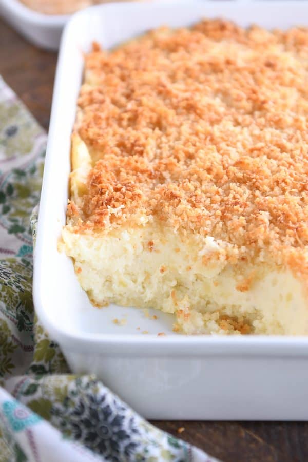 White pan with mashed potatoes and crispy topping.