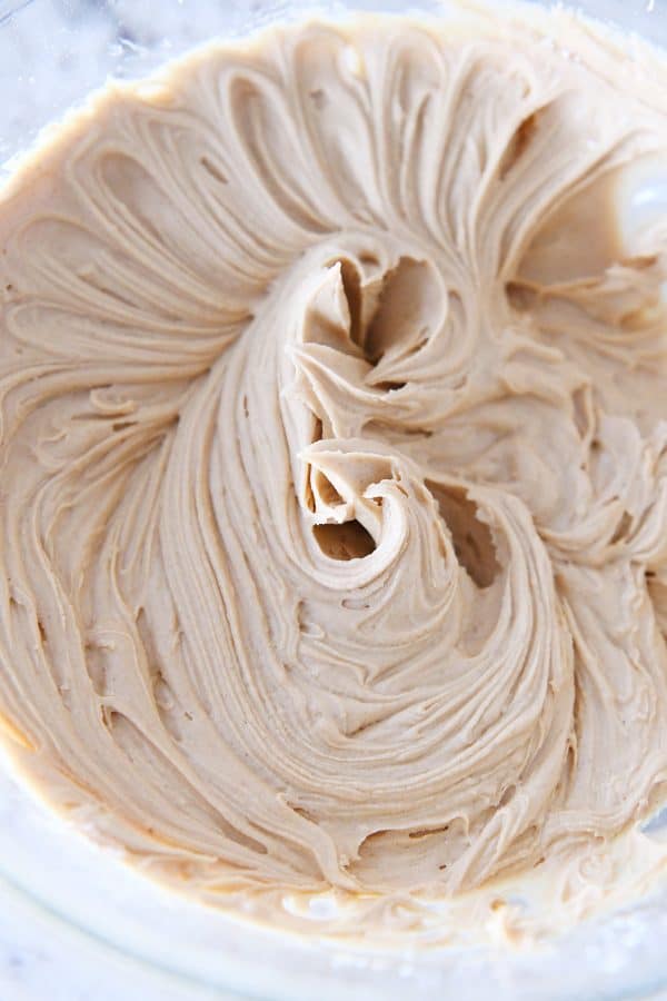 Peanut butter frosting in glass bowl.