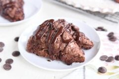 two triple chocolate scones on white plate