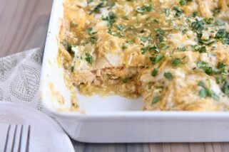 piece removed from pan of chicken enchilada casserole