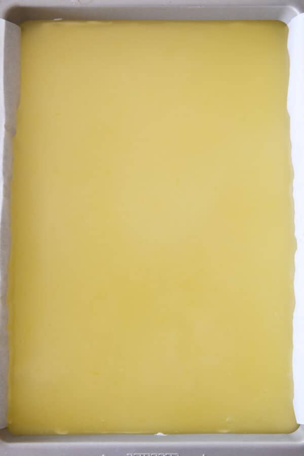 lemon topping on top of cheesecake layer for lemon white chocolate cream bars