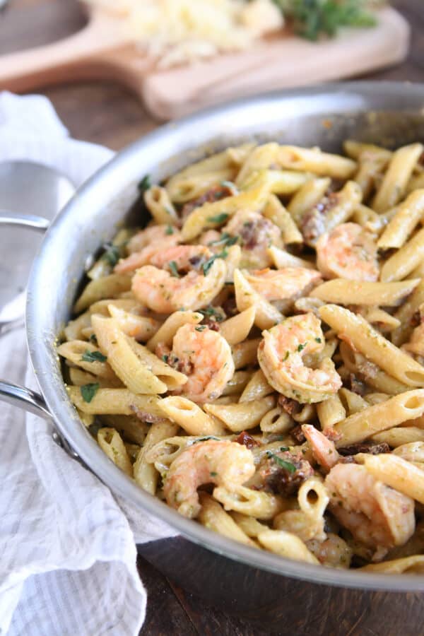 Easy shrimp pesto pasta in skillet.