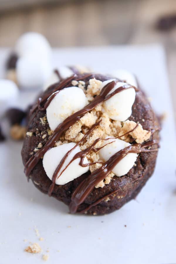 Chocolate cookie with mini marshmallows, graham cracker crumbs and chocolate drizzle.