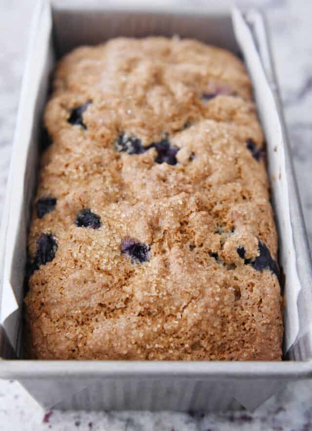 Baked blueberry muffin bread in loaf pan.