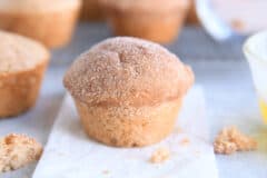 cinnamon sugar doughnut muffin on white napkin