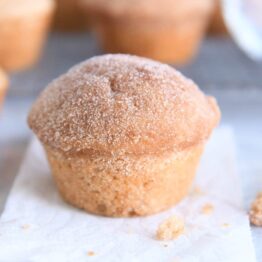 cinnamon sugar doughnut muffin on white napkin