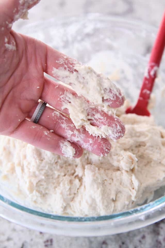Sticky dough residue on fingers.