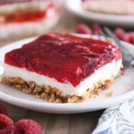 square of raspberry pretzel jello on white plate