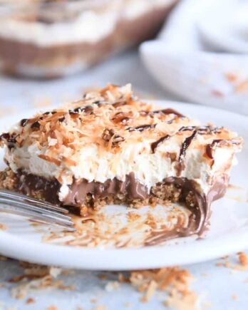 piece of samoas chocolate pudding dessert on white plate with bite taken out