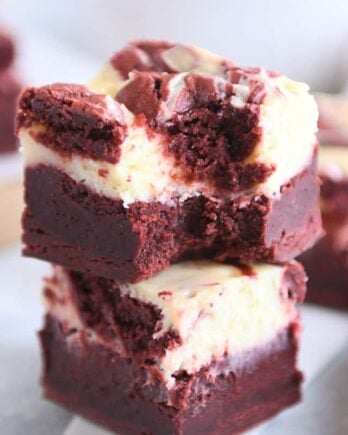 two red velvet brownies stacked on each other