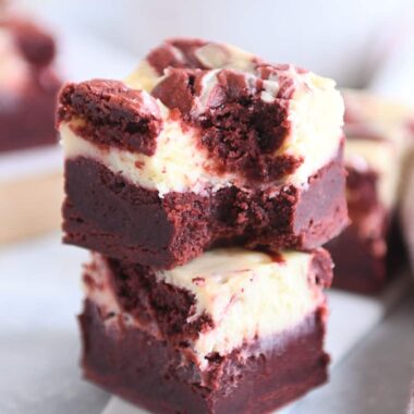 two red velvet brownies stacked on each other