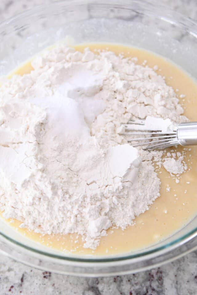 Banana bread batter in a glass bowl. 