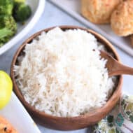 coconut rice in wooden bowl with wooden spoon