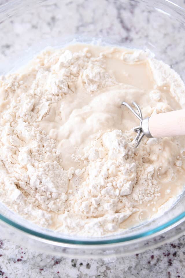 mixing sourdough bread dough with danish dough whisk