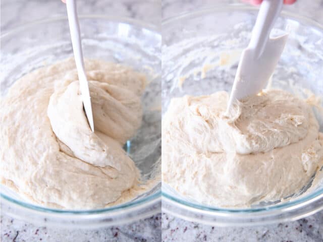 Scraping wet sourdough peasant bread dough from sides of glass bowl with rubber spatula.