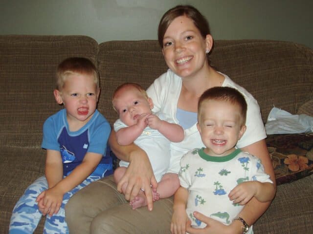 mom with three little boys on couch