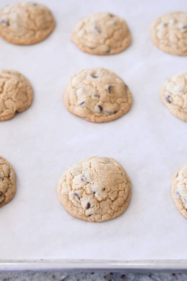 Baked cookies on parchment lined sheet pan.