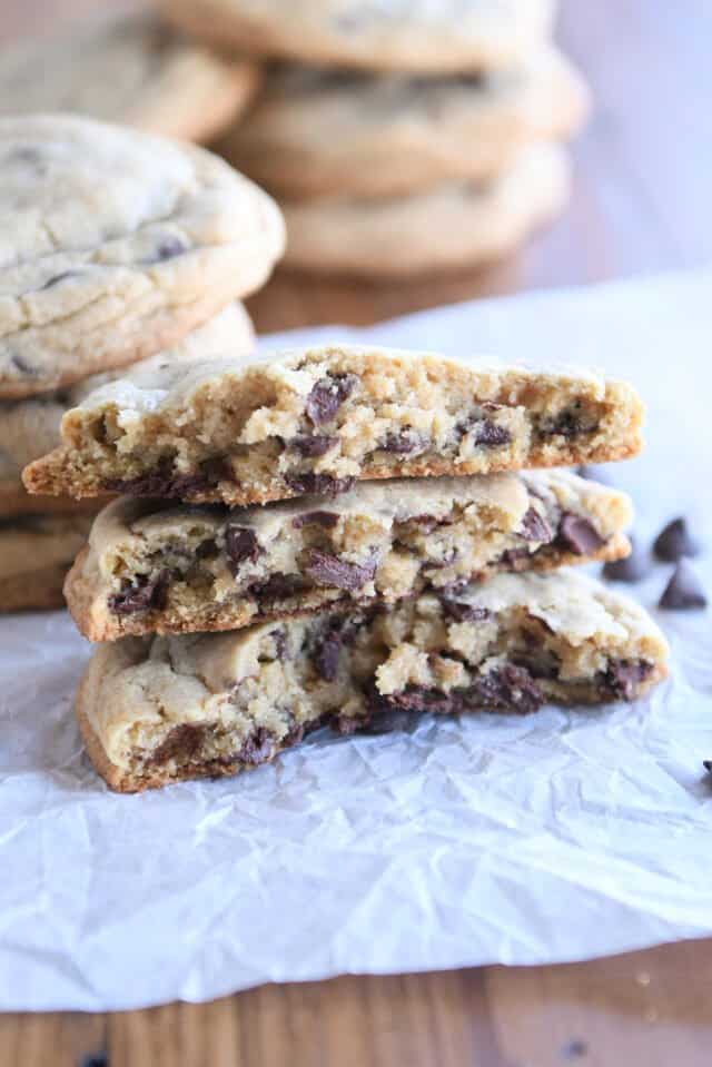 three half cookies stacked on white parchment paper