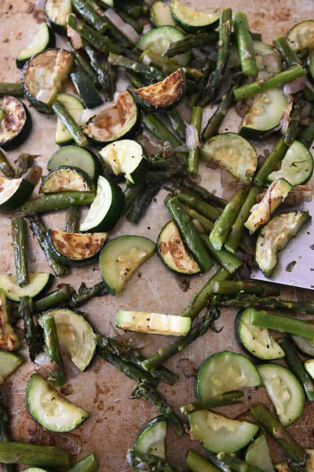 Roasted zucchini and asparagus on sheet pan.