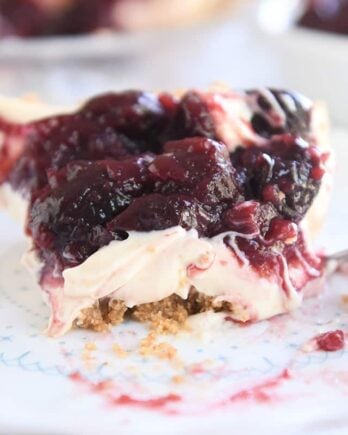 slice of cherry cheesecake pie with bite taken out
