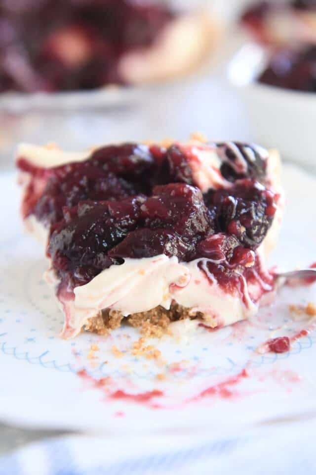 slice of cherry cheesecake pie with bite taken out