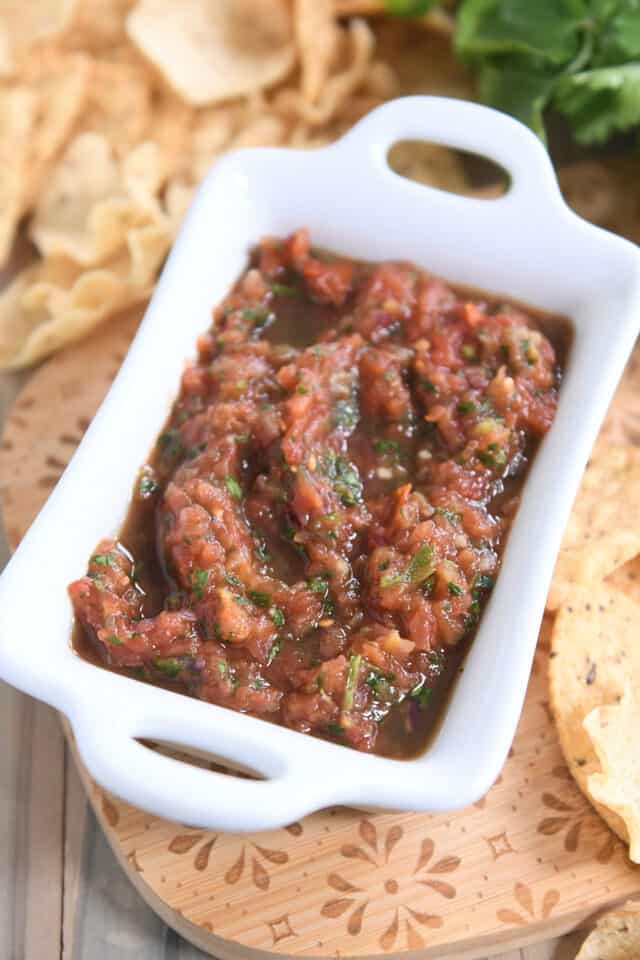 White rectangular dish with homemade salsa and tortilla chips.