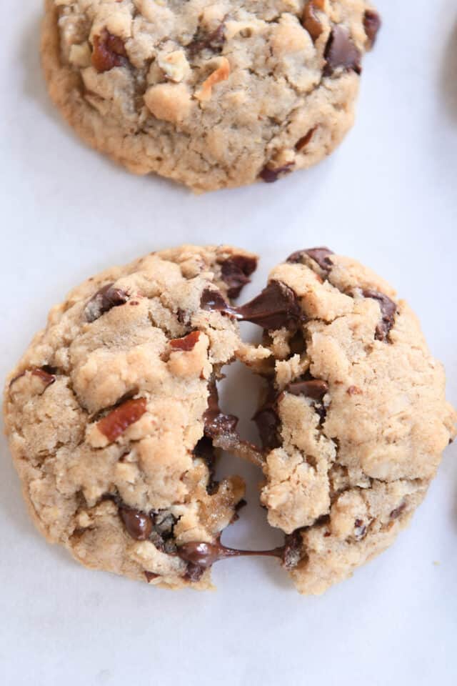 warm cookie split in half with melted chocolate chips.