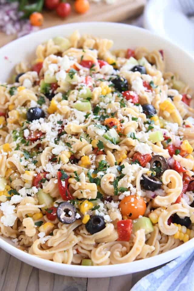 Easy Greek pasta salad in white serving bowl.