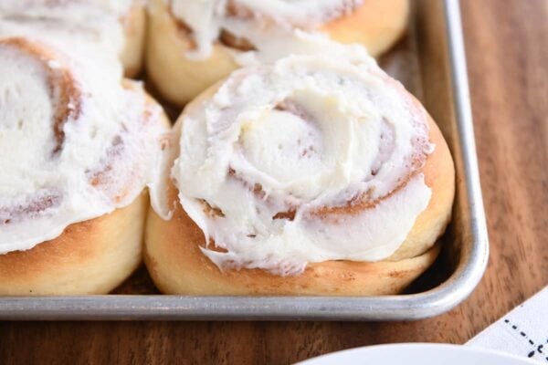 Grilled cinnamon rolls, frosting on pot