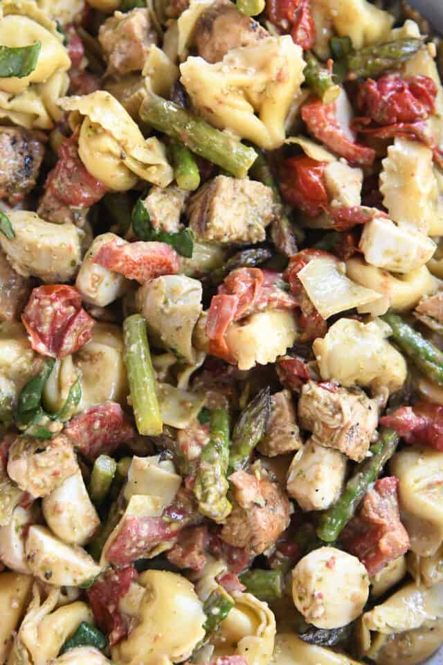 Asparagus, tortellini, roasted tomatoes and red peppers, and grilled chicken tossed together.