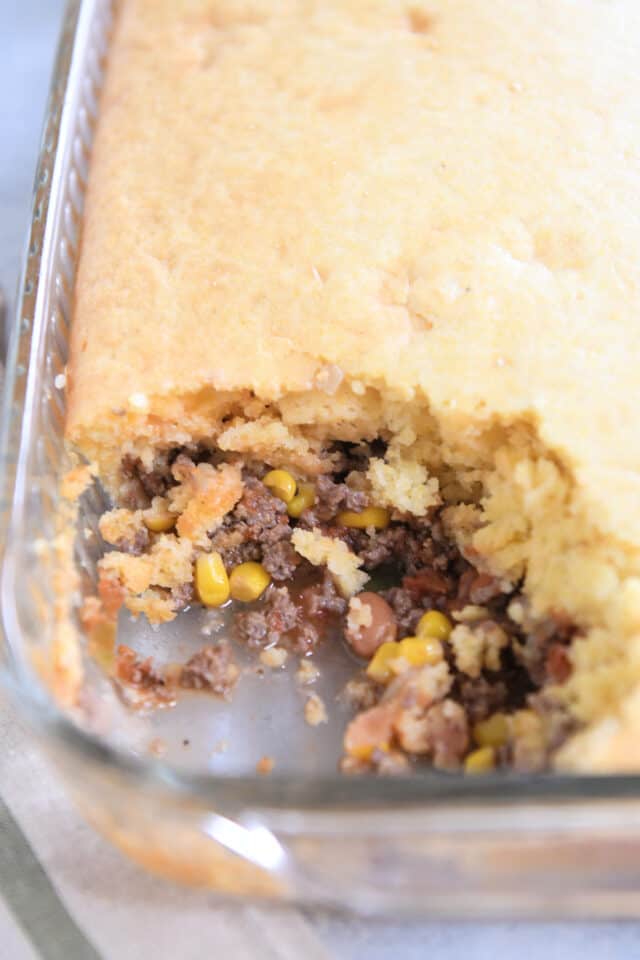 9X13 inch glass pan filled with beef, beans, corn, salsa and cornbread.