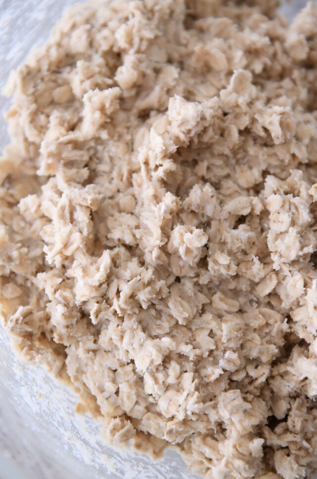 Oatmeal cookie dough in glass bowl.