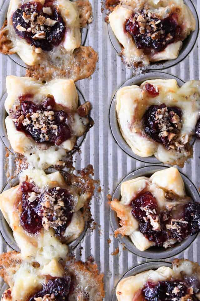 Baked cranberry brie bites in mini muffin tin.