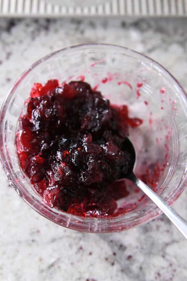 Cranberry sauce in small glass bowl.