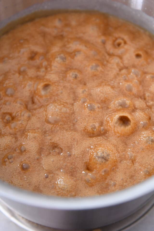 Golden caramel is bubbling in the pan.