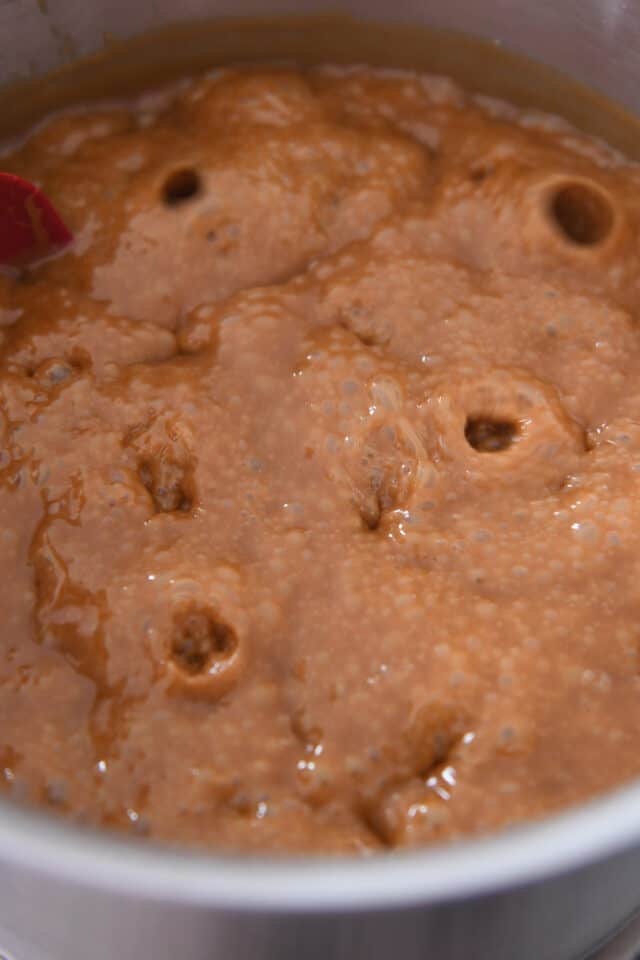 Bubbling pan of hot caramel.