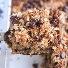 Square piece of banana oat snack cake on spatula.