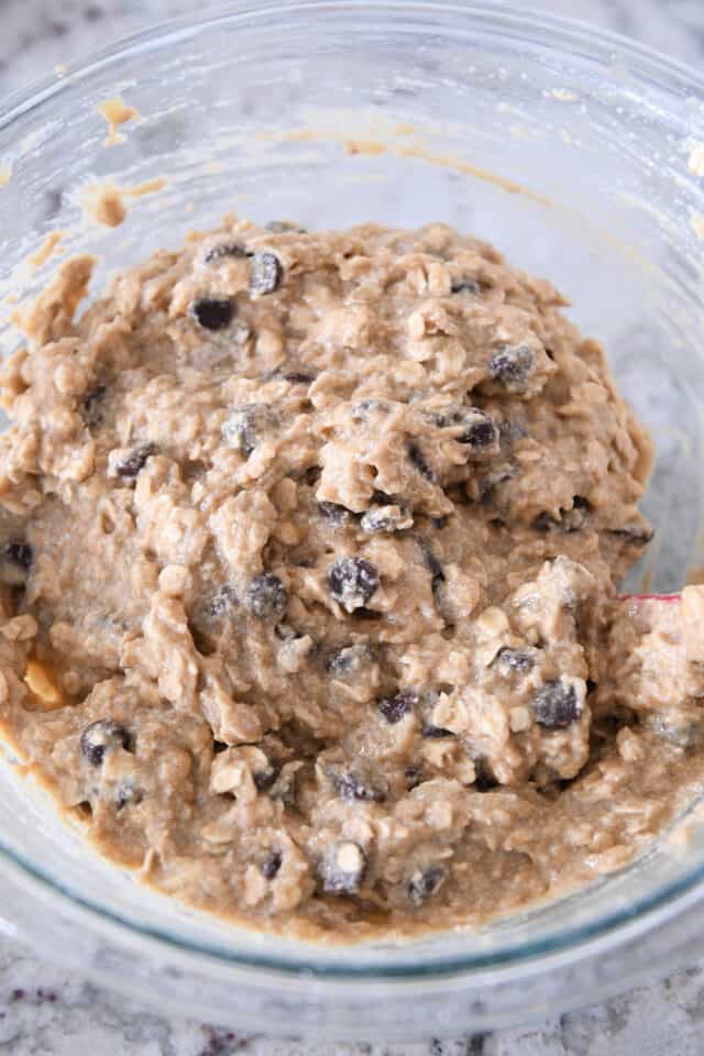 Bowl of banana bread batter with chocolate chips.