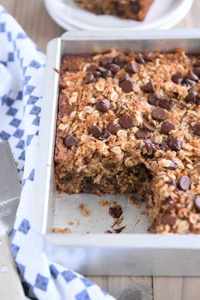 Piece of cake removed from 8X8-inch pan of banana cake.