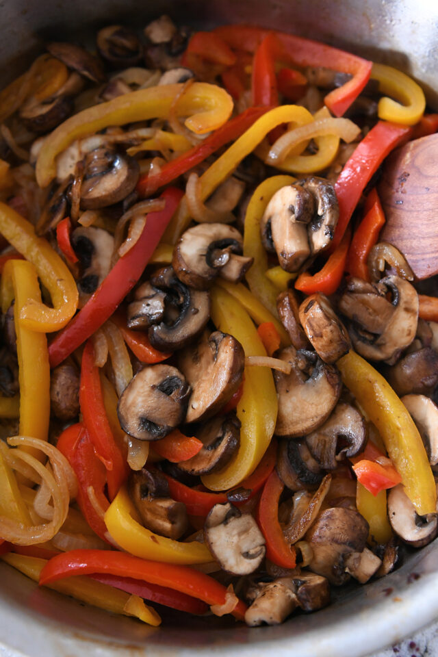 Pan with bell peppers, onions and mushrooms.