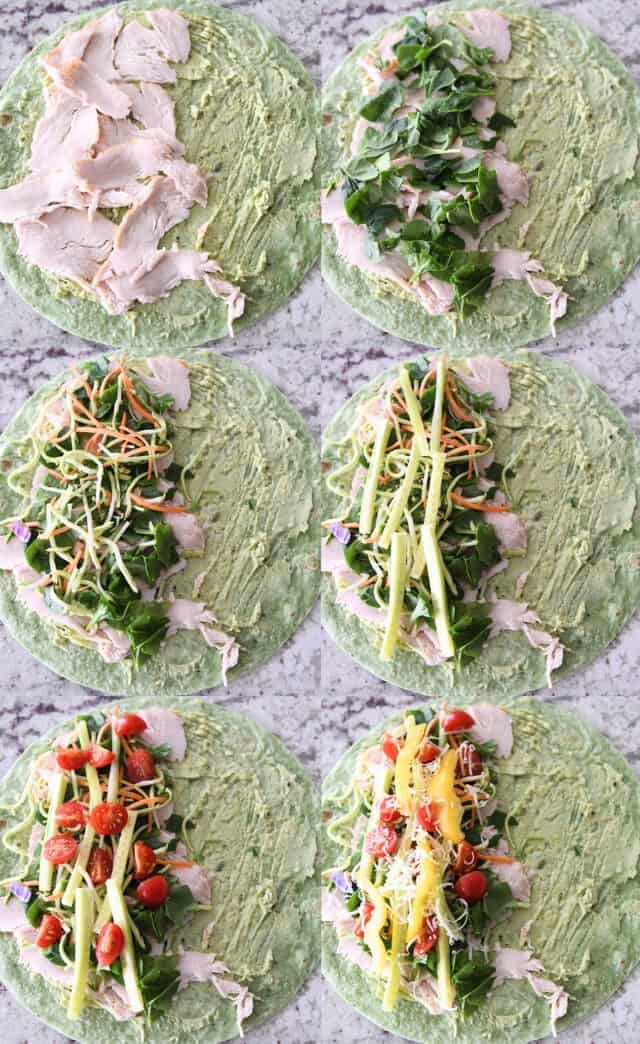 Assemble turkey wraps with spinach wrap, turkey, veggies, and parmesan cheese.