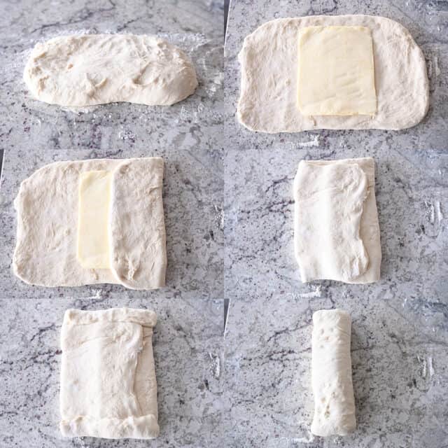 Placing butter sheet on bread dough, folding bread dough in thirds over butter, pinching edges of dough and folding in half.